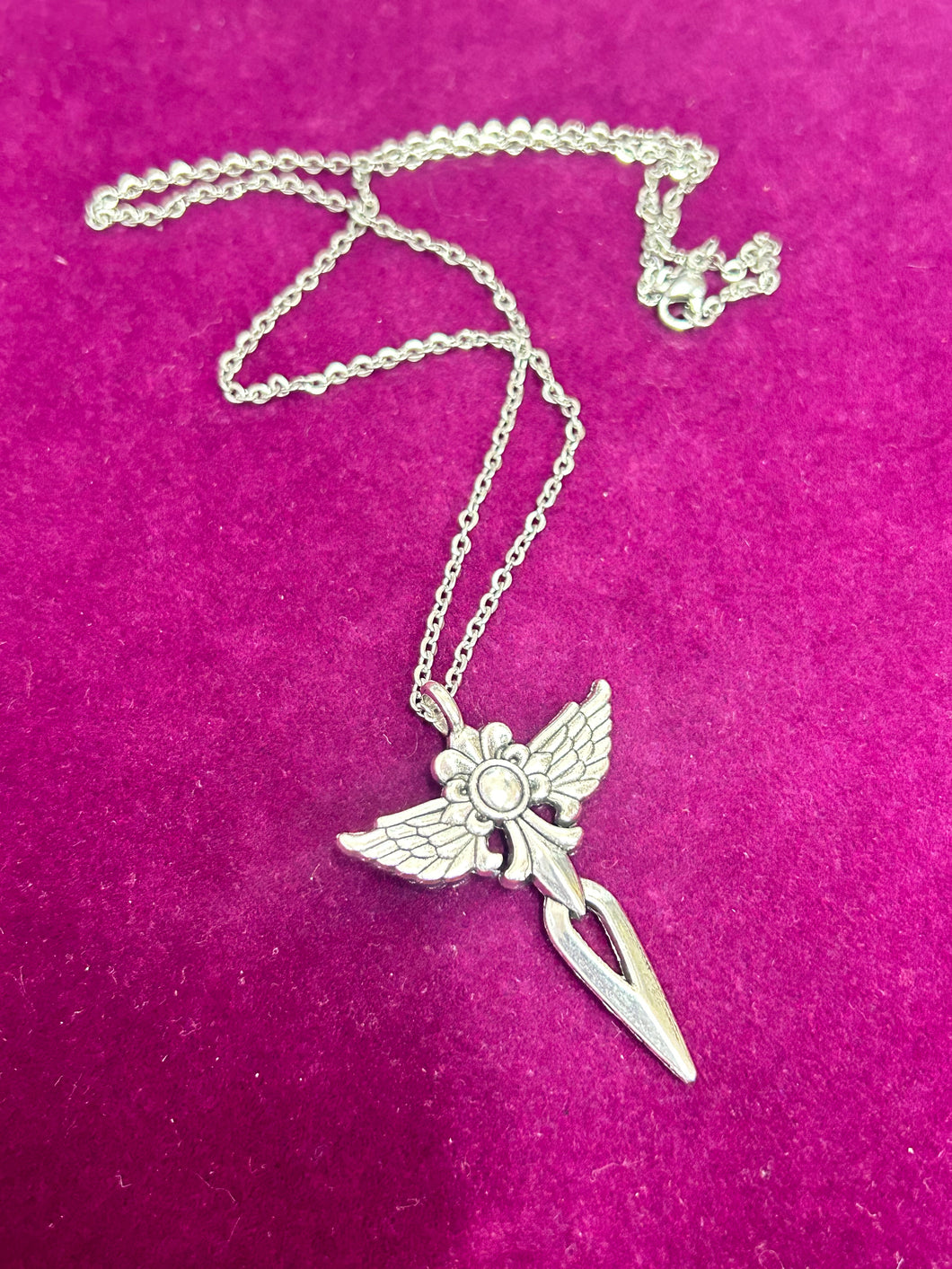 CROSS NECKLACE WITH WINGS